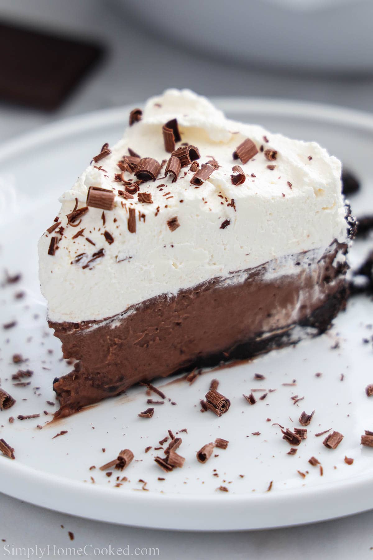 slice of chocolate cream pie on a white plate