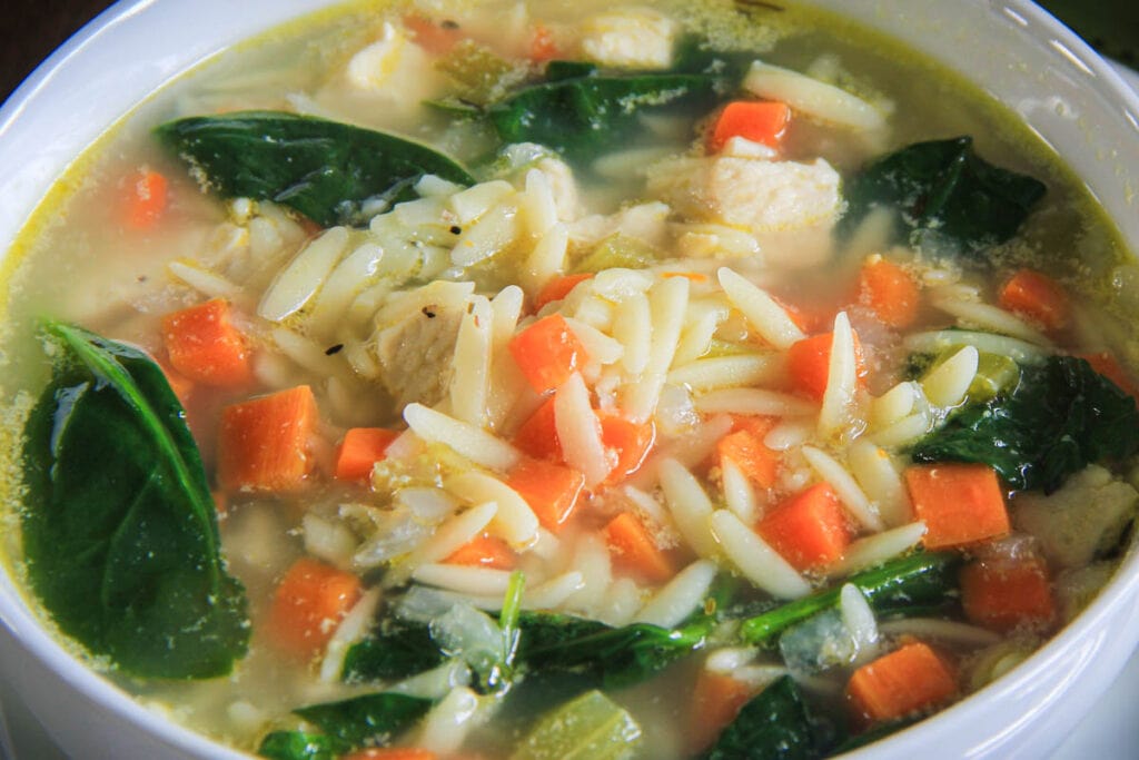 Lemon Chicken Orzo Soup in a bowl.