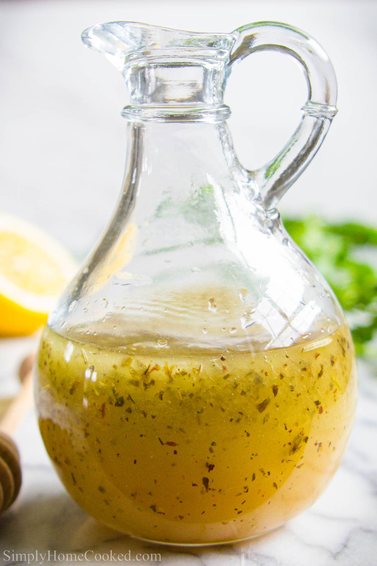 Greek dressing for Spinach Salad in a cruet.