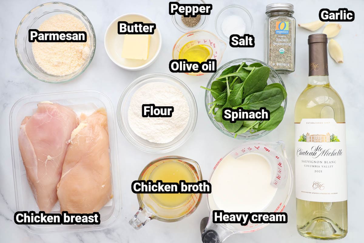Chicken Florentine ingredients: chicken breast, Parmesan, butter, olive oil, salt, pepper, spinach, chicken broth, flour, heavy cream, garlic cloves, and white wine.