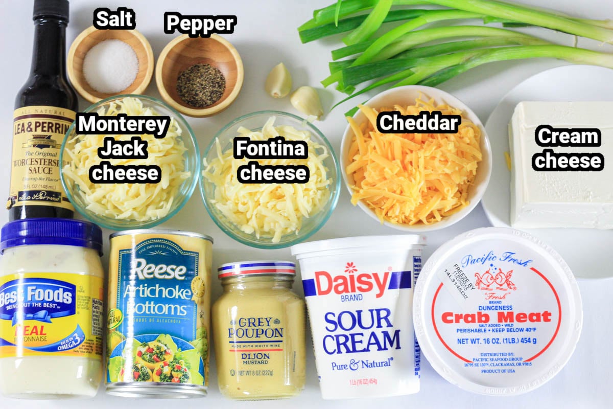 Ingredients for Crab Artichoke Dip: mayonnaise, artichoke bottoms, dijon mustard, sour cream, crab meat, cram cheese, cheddar, fontina cheese, monterey jack cheese, worcestershire sauces, green onions, garlic cloves, salt, and pepper.