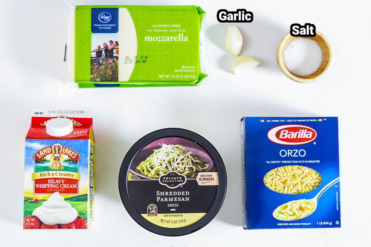 Ingredients in Creamy Orzo: mozzarella, Parmesan, orzo, heavy cream, salt, and garlic cloves.