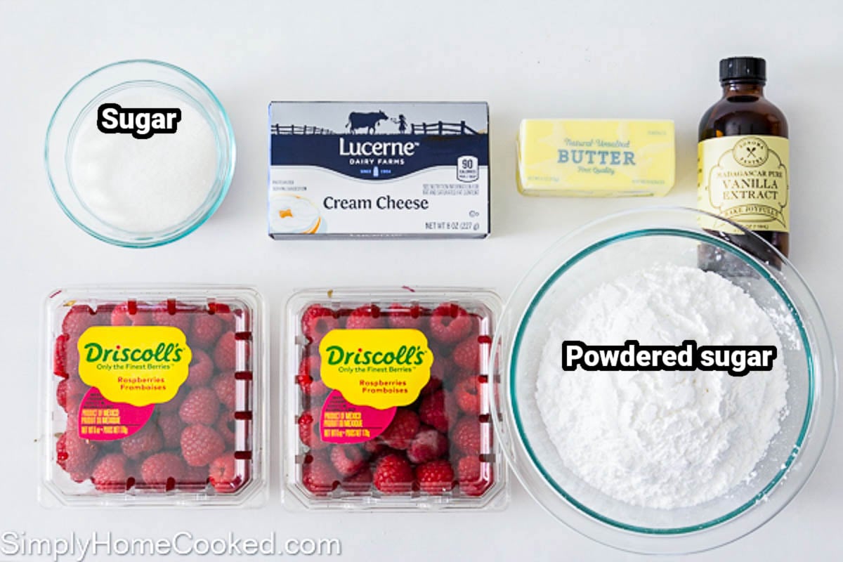 Ingredients for Raspberry Buttercream: cream cheese, sugar, raspberries, butter, vanilla, and powdered sugar.