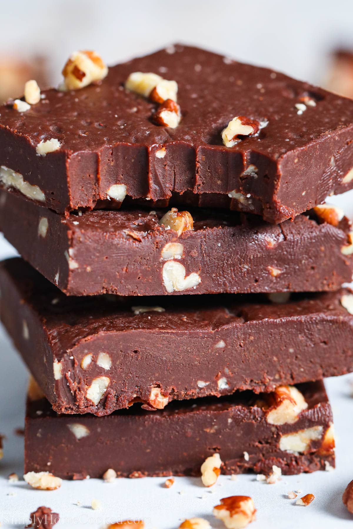 Stack of Paleo Chocolate Fudge bars, the top one missing a bite.