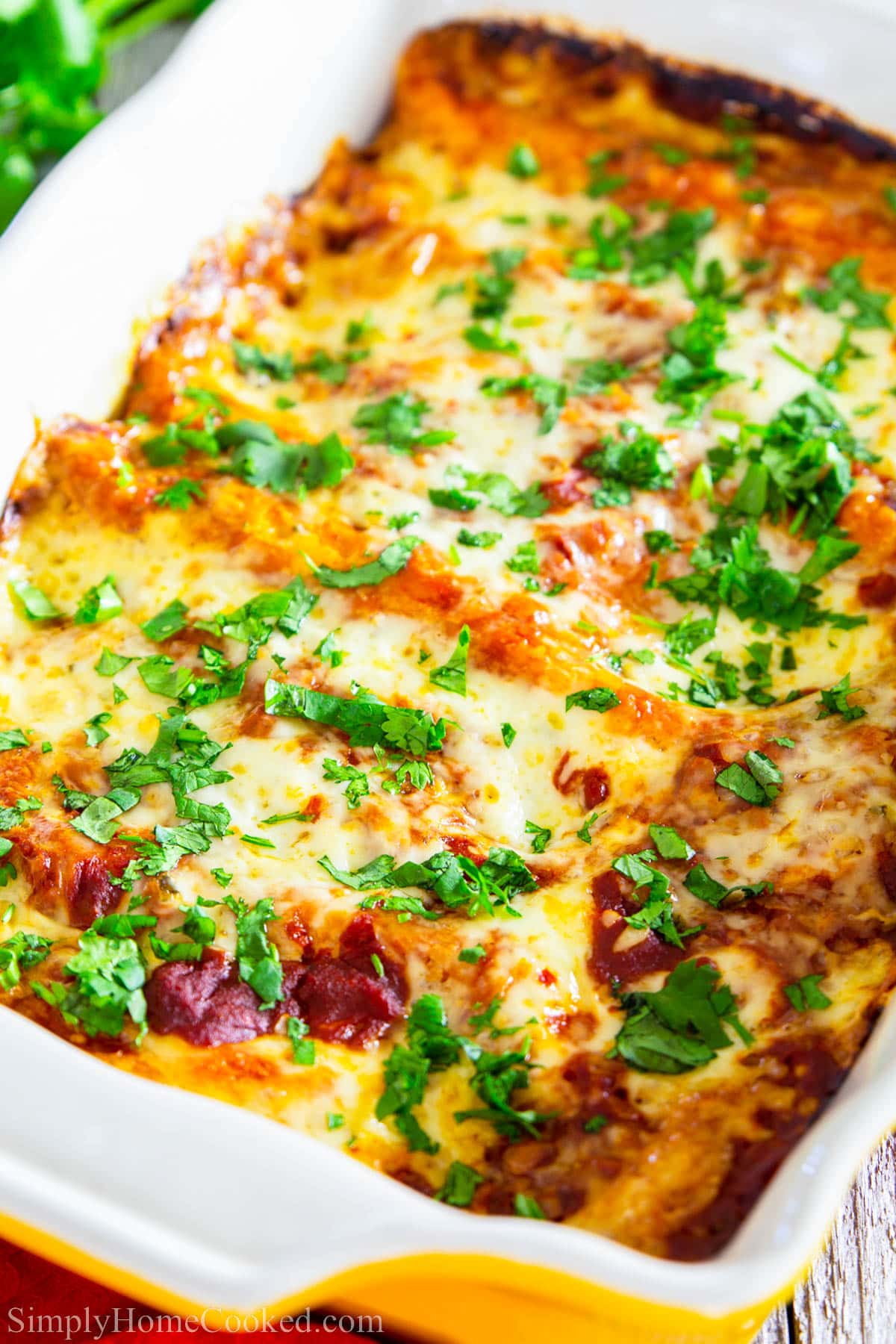 Chicken Enchiladas with Red Sauce in a baking dish.