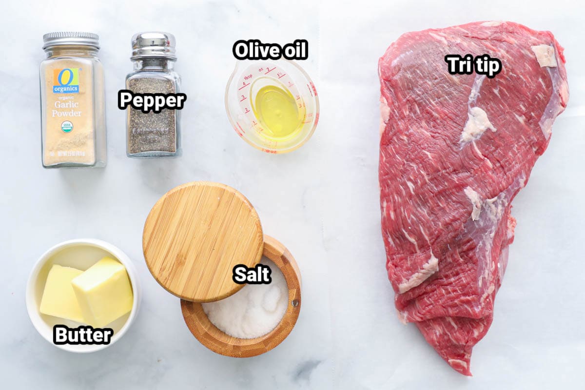 Ingredients for Smoked Tri Tip: tri tip, olive oil, pepper, garlic powder, salt, and butter.