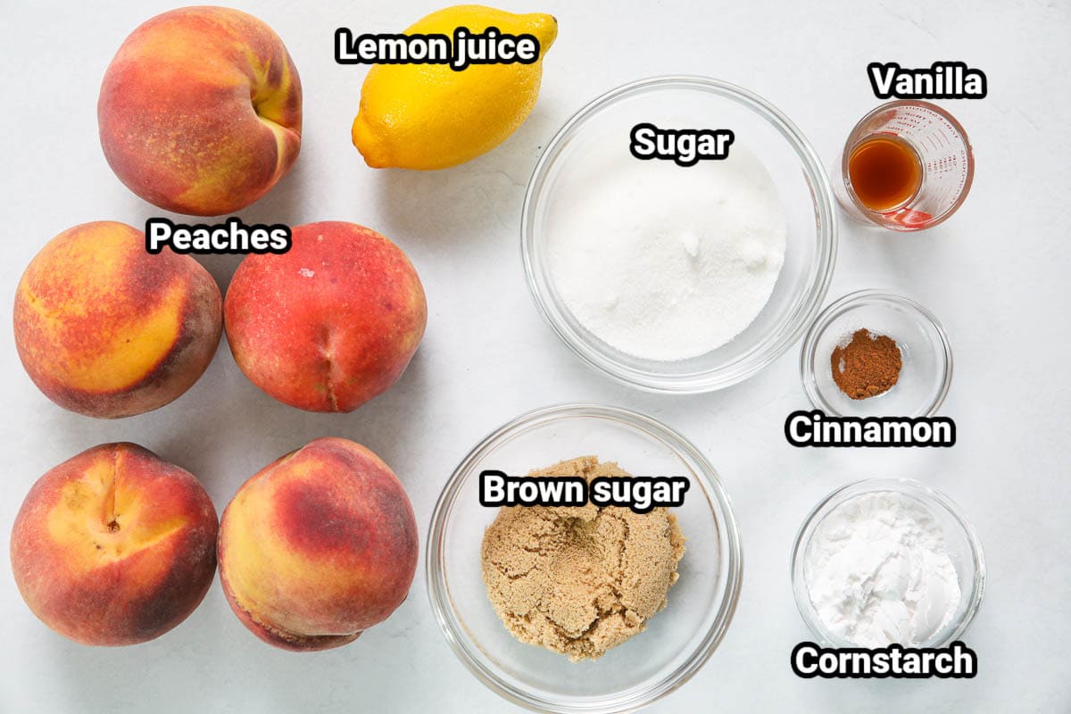 Perfect Peach Pie ingredients: peaches, lemon juice, vanilla, sugar, brown sugar, cinnamon, and cornstarch. 