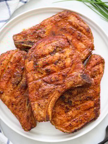 Pile of Smoked Pork Chops on a plate.