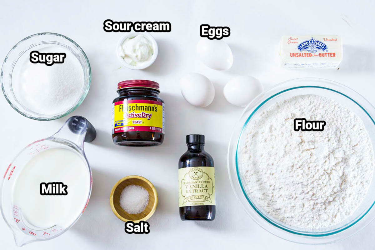 Ingredients for Poppy Seed Pull Apart Bread dough: flour, sugar, milk, sour cream, eggs, butter, vanilla, yeast, salt, and eggs.