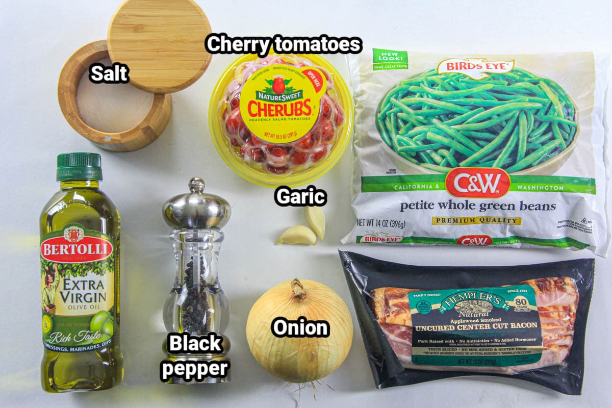 Ingredients for Green Bean Salad with Bacon: green beans, bacon, onion, garlic, tomatoes, salt, pepper, and oil. 