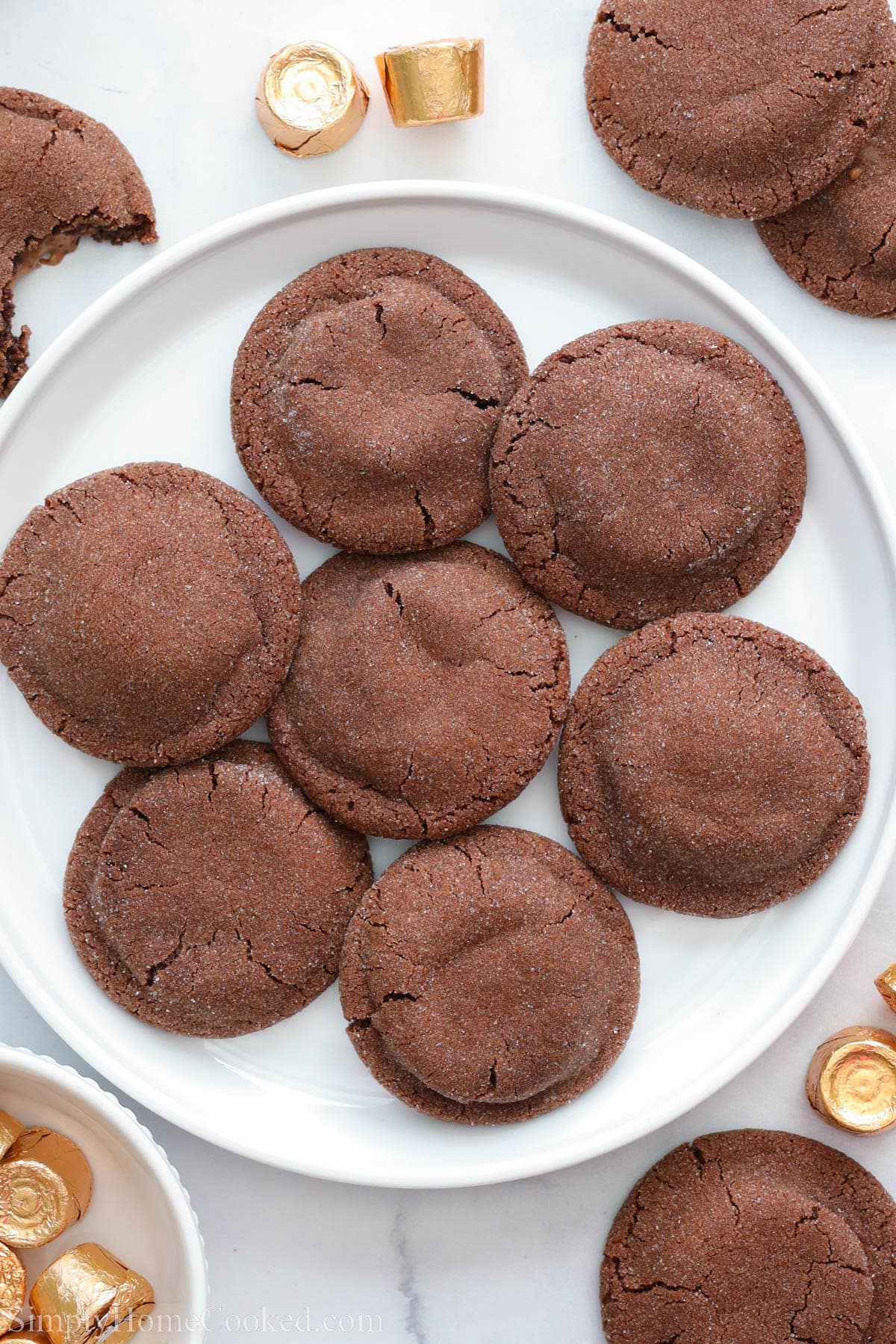 Rolo Cookies on a white plate with Rolos nearby.