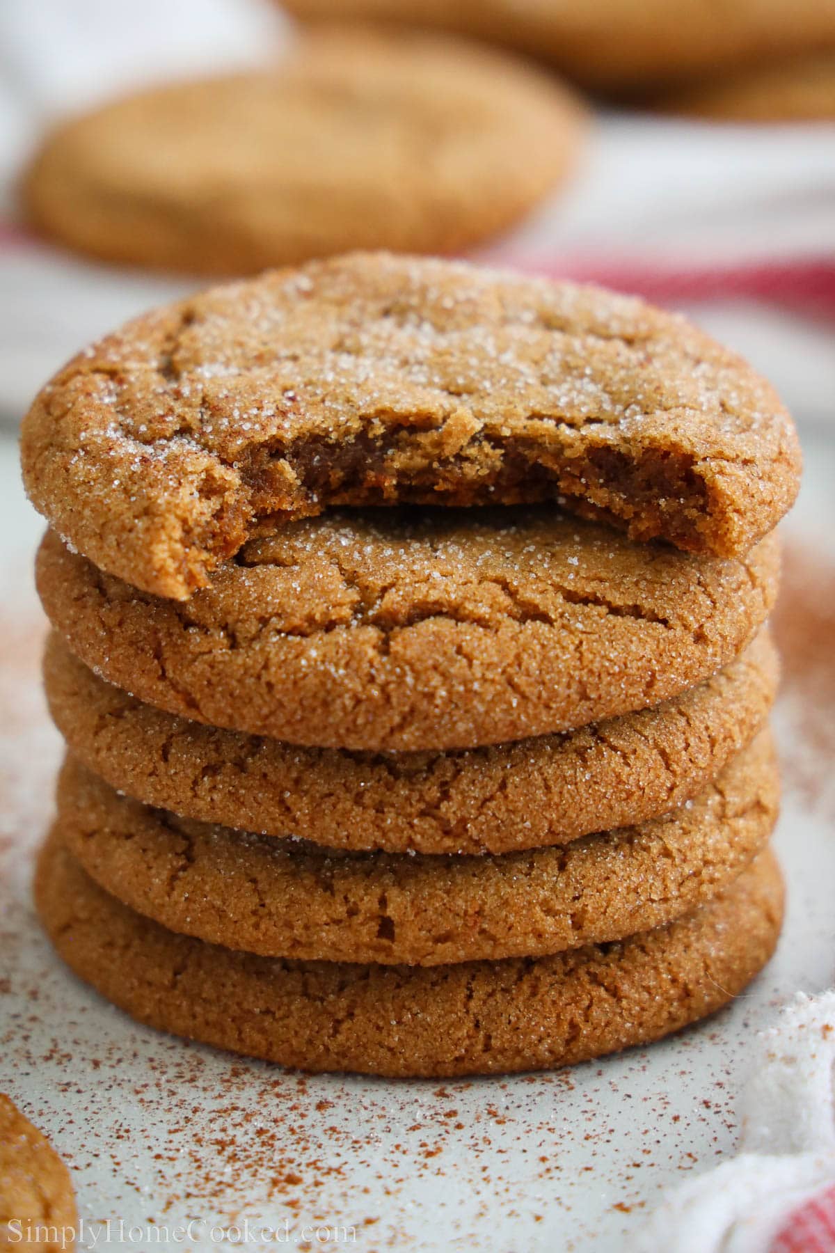 Stack of Ginger Molasses Cookies, the top one missing a bite.