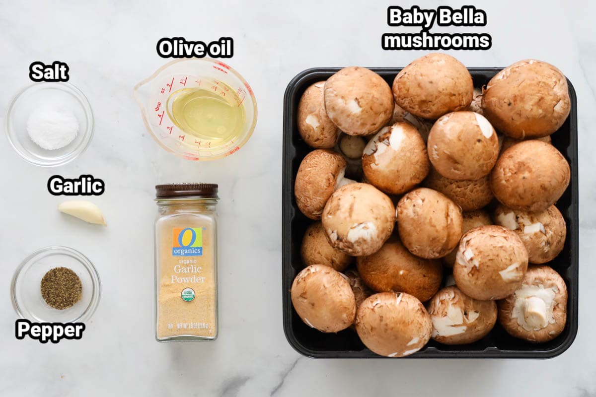 Ingredients for Air Fryer Mushrooms: Baby Bella mushrooms, olive il, salt, pepper, garlic powder, and garlic clove.
