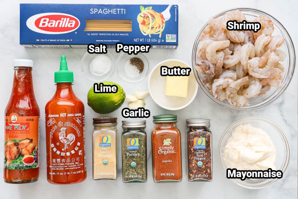 Ingredients for Bang Bang Shrimp Pasta: spaghetti, shrimp, butter, salt, pepper, lime, garlic cloves, mayo, red pepper flakes, paprika, parsley, garlic powder, sriracha, and sweet chili sauce.