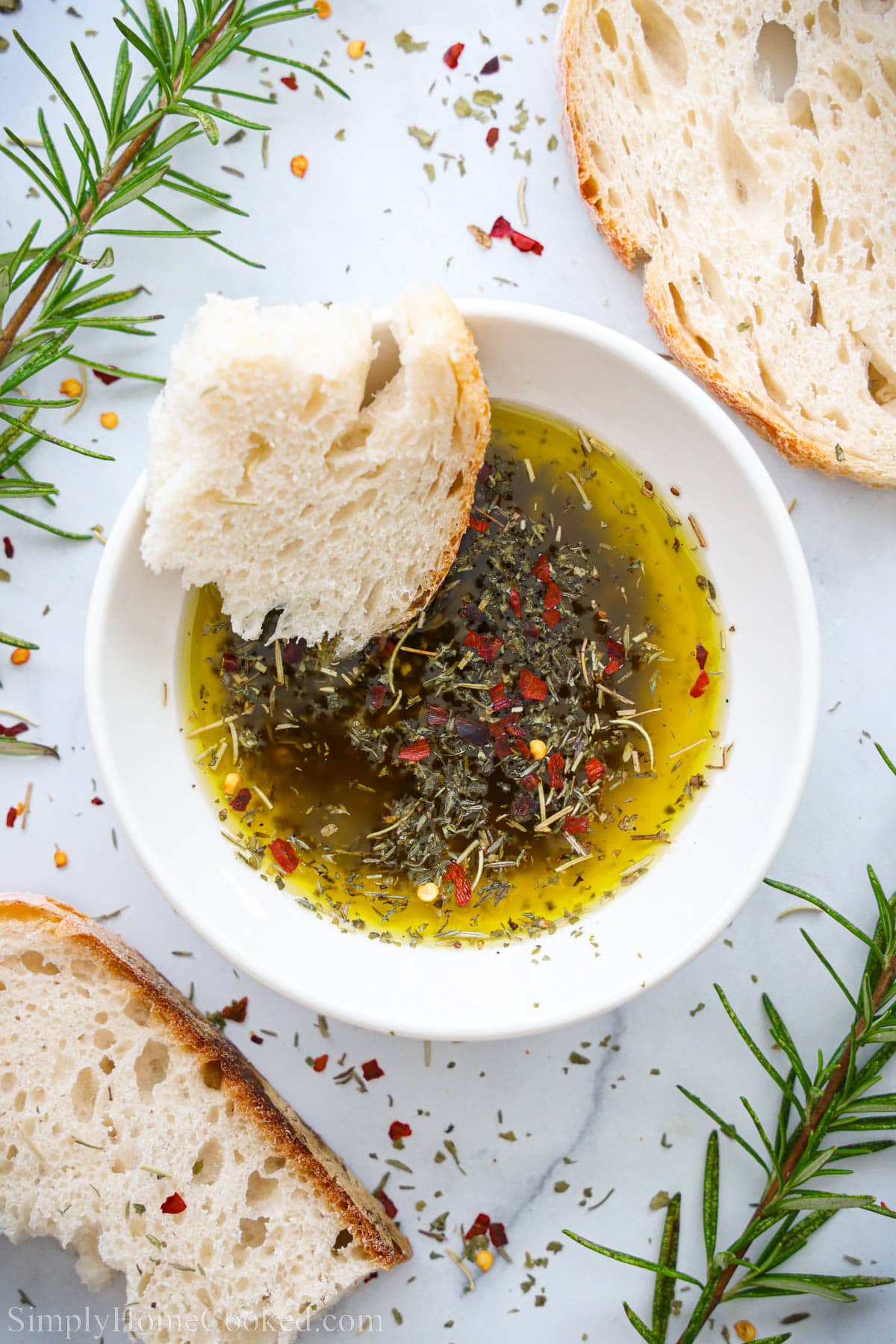 Bread Dipping Oil in a bowl with bread on the side.