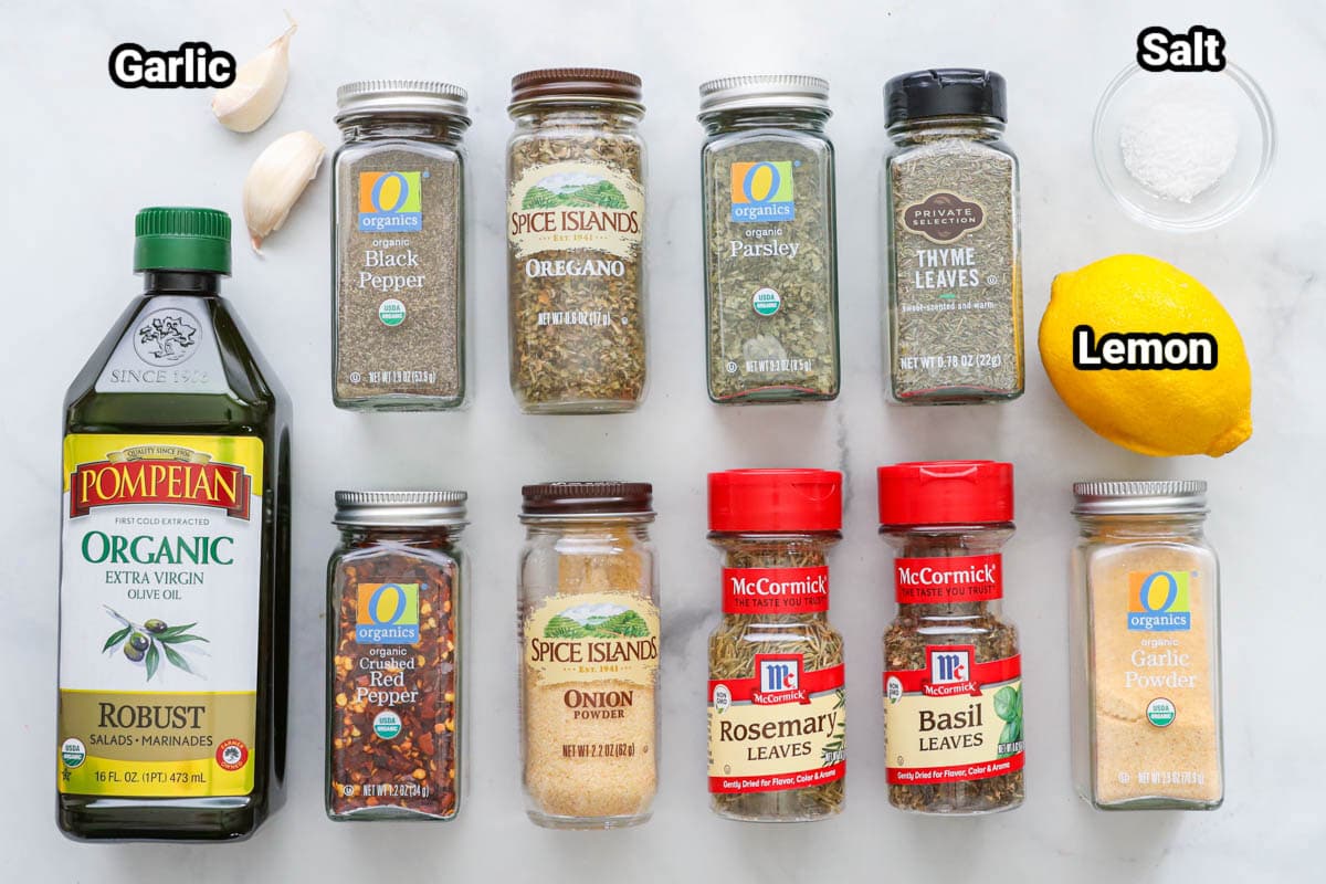 Ingredients for Bread Dipping Oil: olive oil, garlic, black pepper, oregano, parsley, thyme, red pepper flakes, onion powder, rosemary, basil, garlic powder, salt, and lemon.