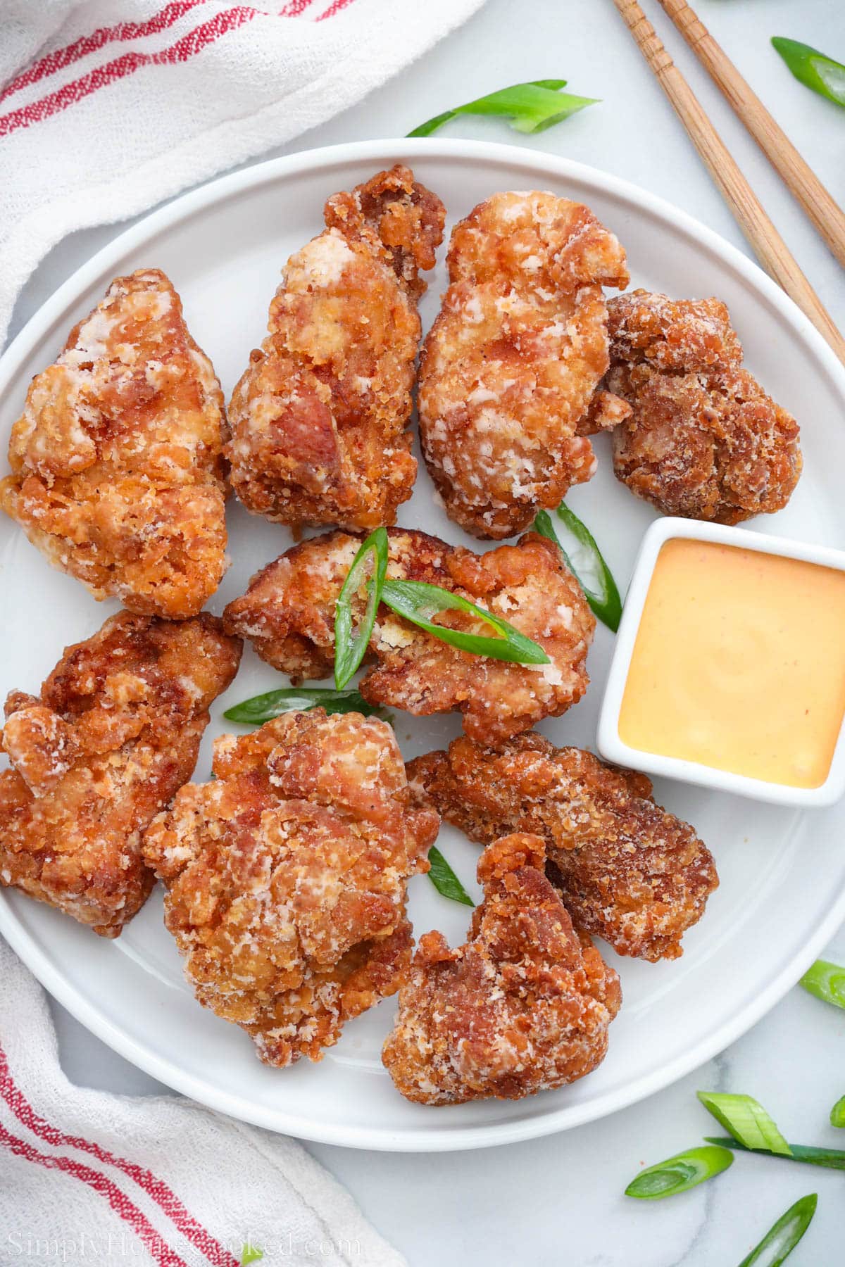 Chicken Kaarage on a plate with sauce.