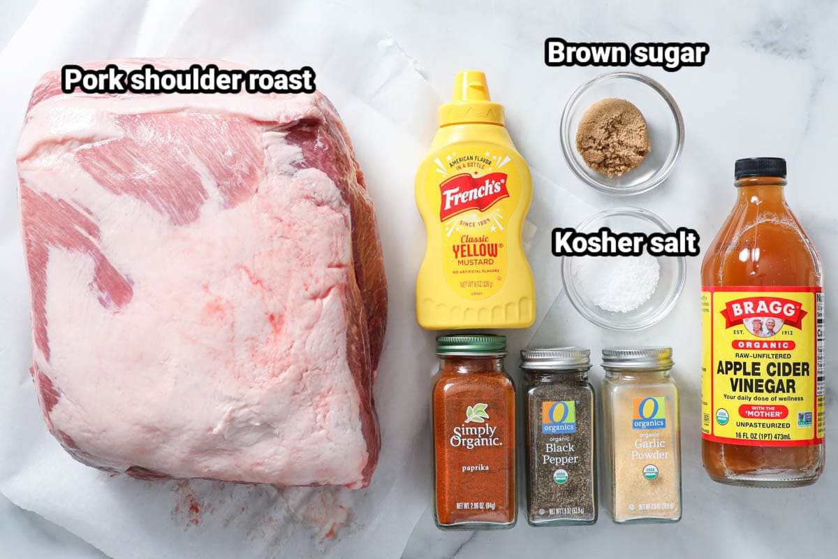 Ingredients for Smoked Pulled Pork: pork shoulder roast, brown sugar, yellow mustard, apple cider vinegar, kosher salt, paprika, black pepper, and garlic powder.