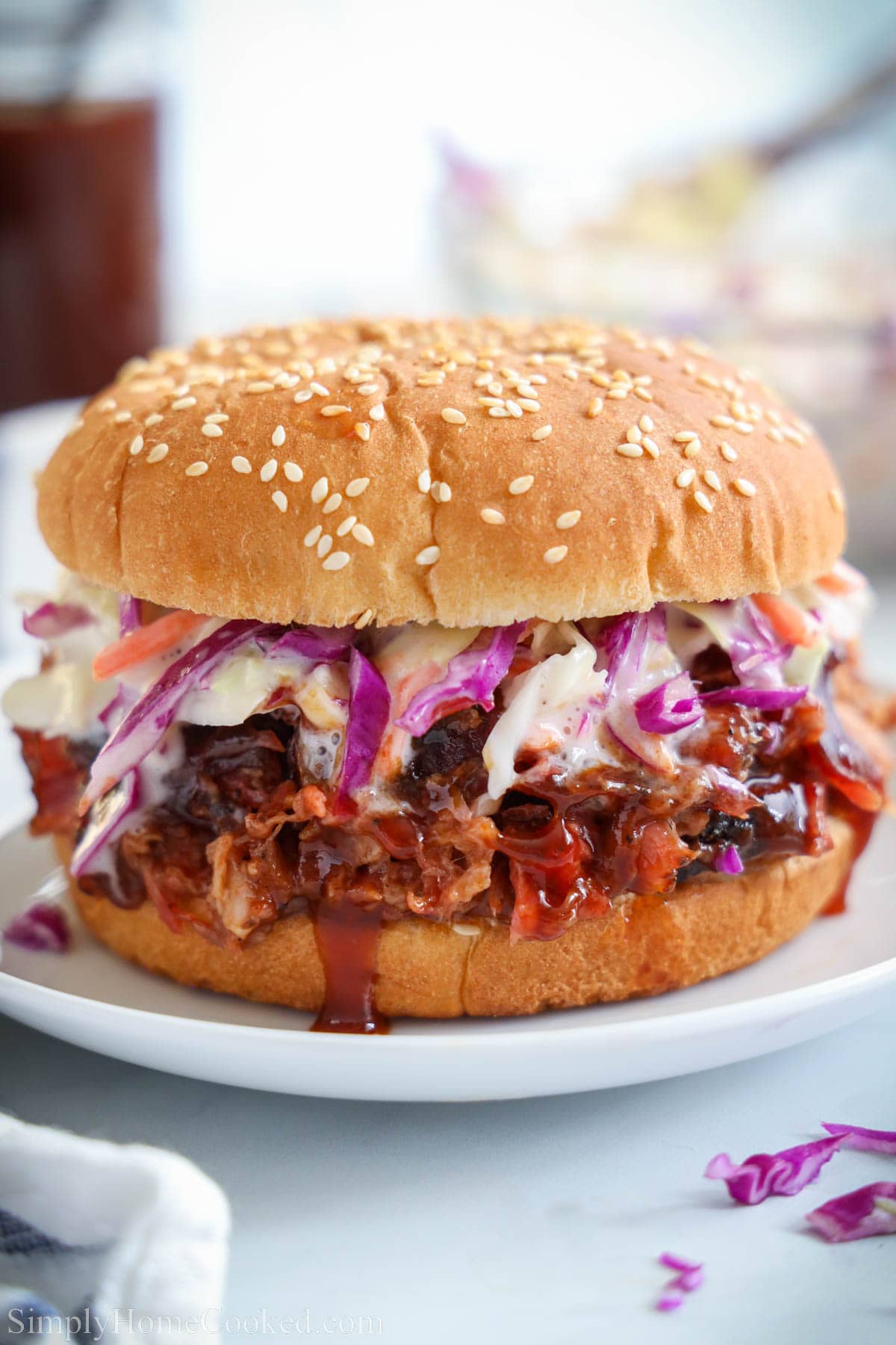 Smoked Pulled Pork on a bun with coleslaw.