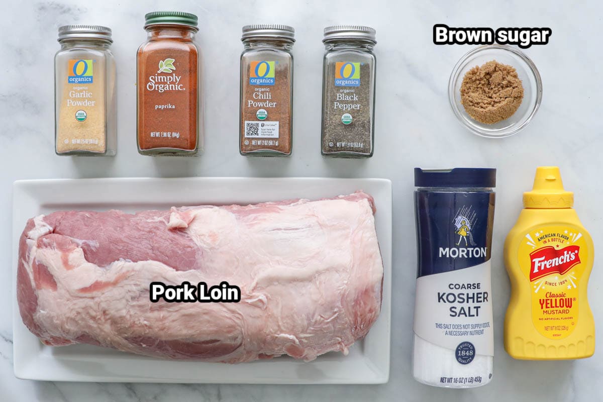 Smoked Pork Loin ingredients: pork loin, mustard, kosher salt, brown sugar, black pepper, chili powder, garlic powder, and paprika. 