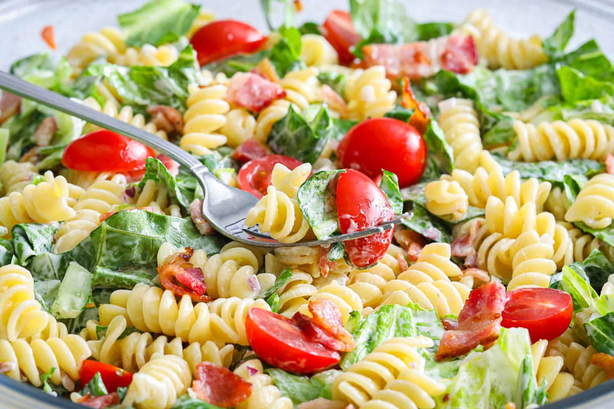 Fork laying on a BLT Pasta Salad.
