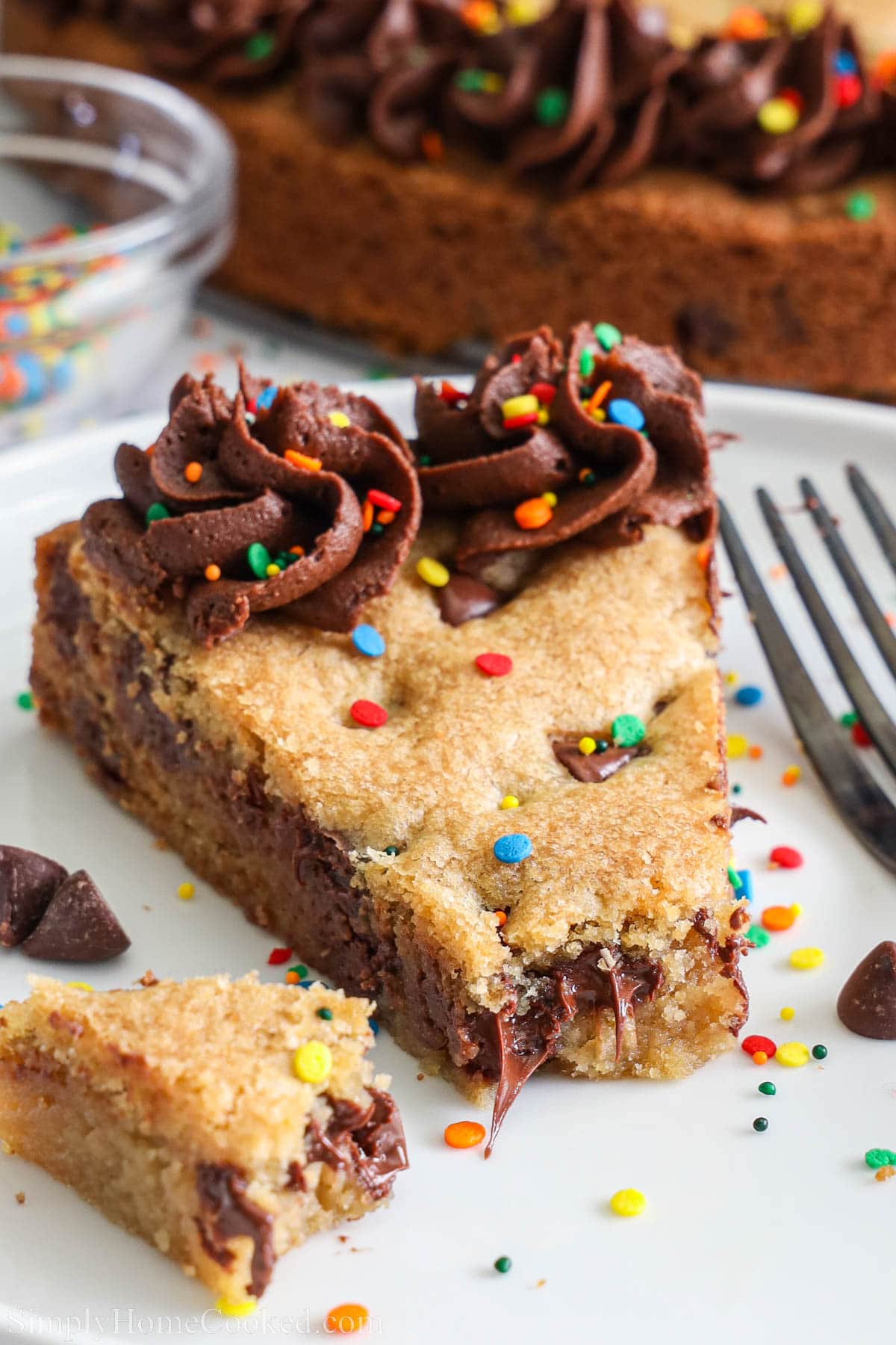 Slice of Cookie Cake missing a bite.
