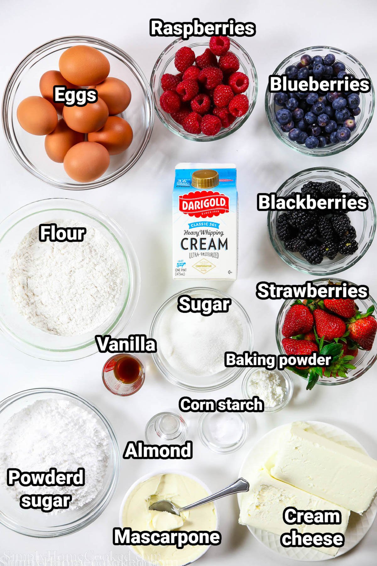 Ingredients for Berry Chantilly Cake: eggs, raspberries, blueberries, blackberries, strawberries, heavy cream, flour, sugar, vanilla, almond extract, baking powder, cornstarch, powdered sugar, mascarpone cheese, and cream cheese.
