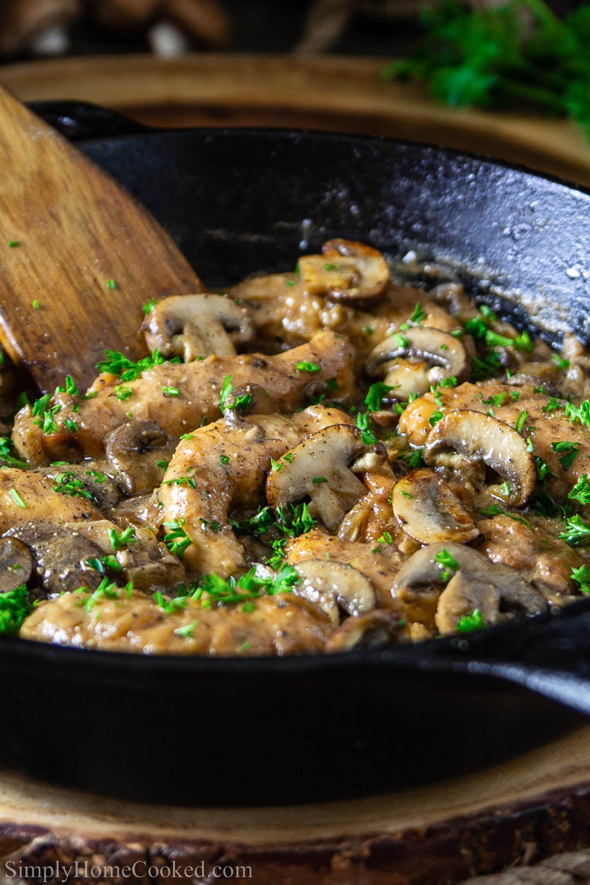 Easy Chicken Marsala in a pan and topped with parsley.