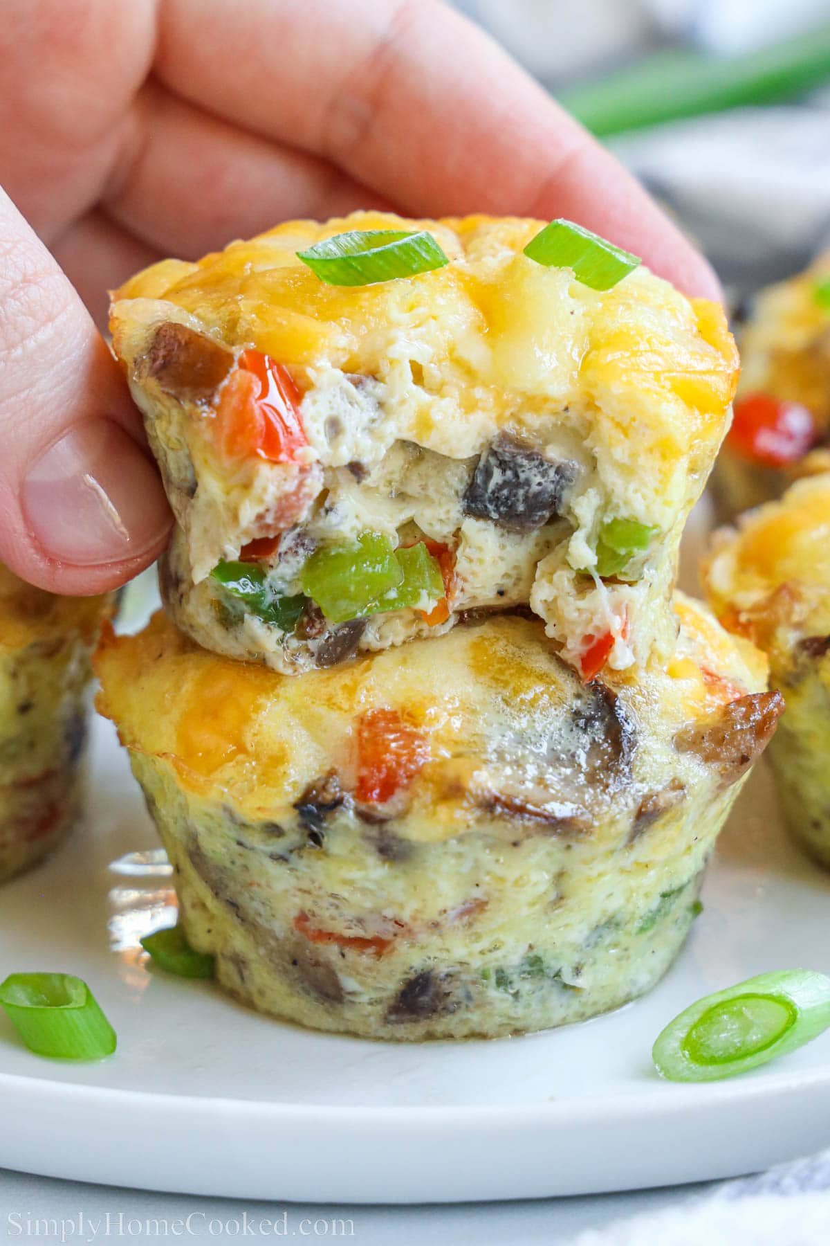 Egg Bites stacked on top of each other, one missing a bite.