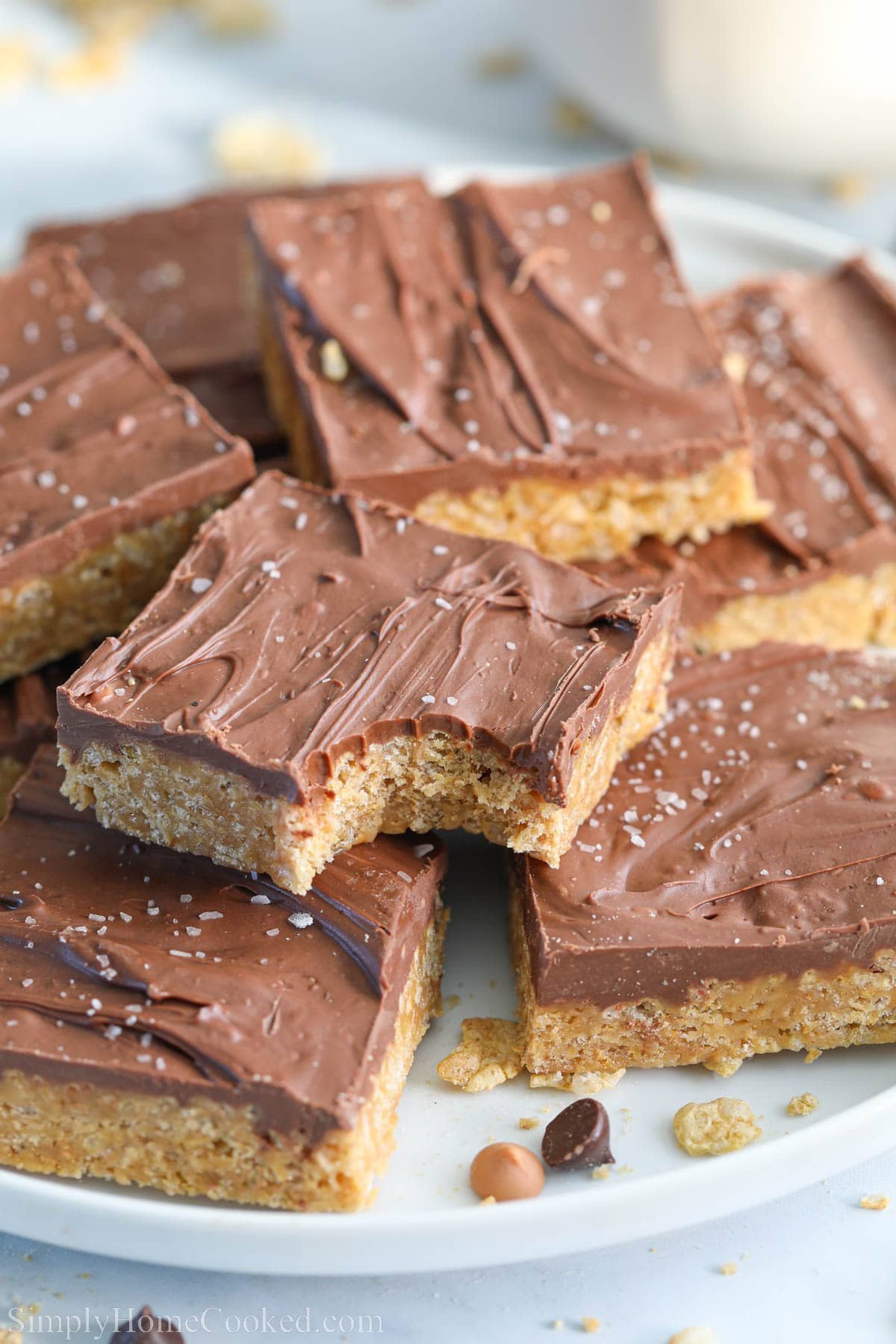 Chewy Special K Bars in a pile, one missing a bite.