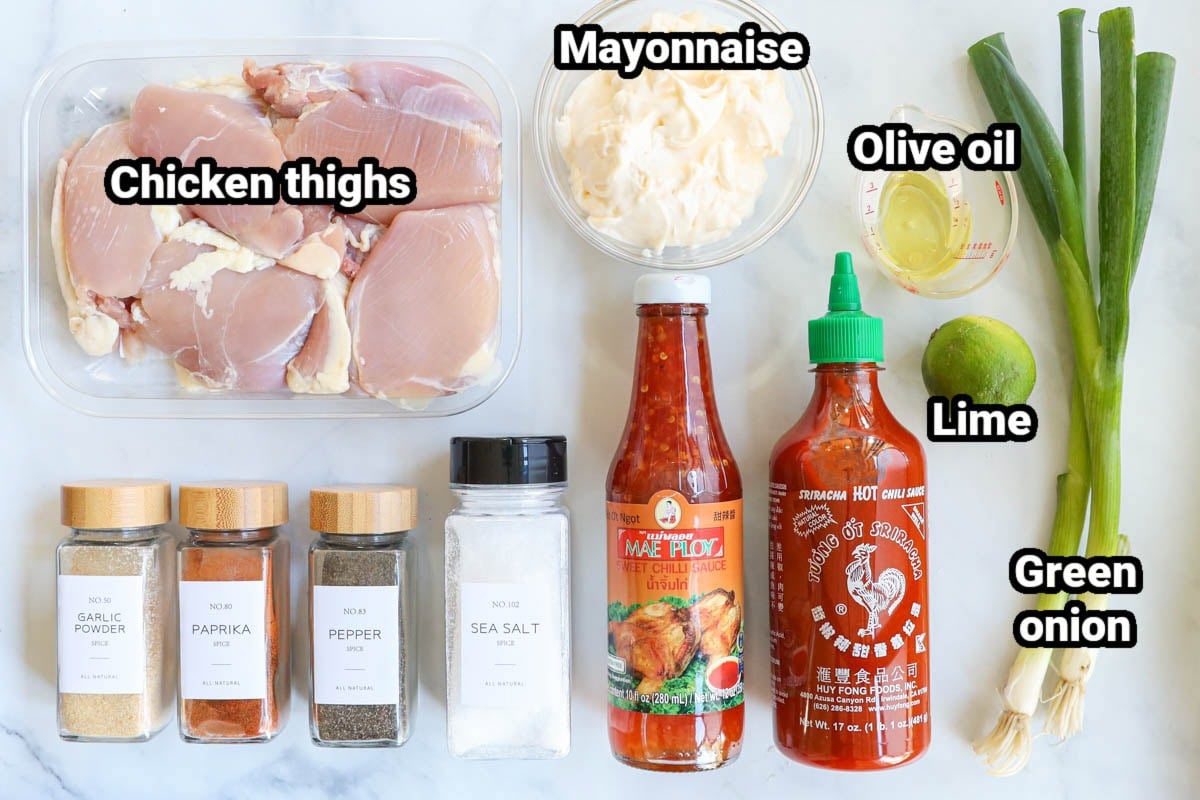 Ingredients for Bang Bang Chicken Skewers: chicken thighs, mayonnaise, olive oil, lime, green onion, sriracha, sweet chili sauce, sea salt, black pepper, paprika, and garlic powder. 