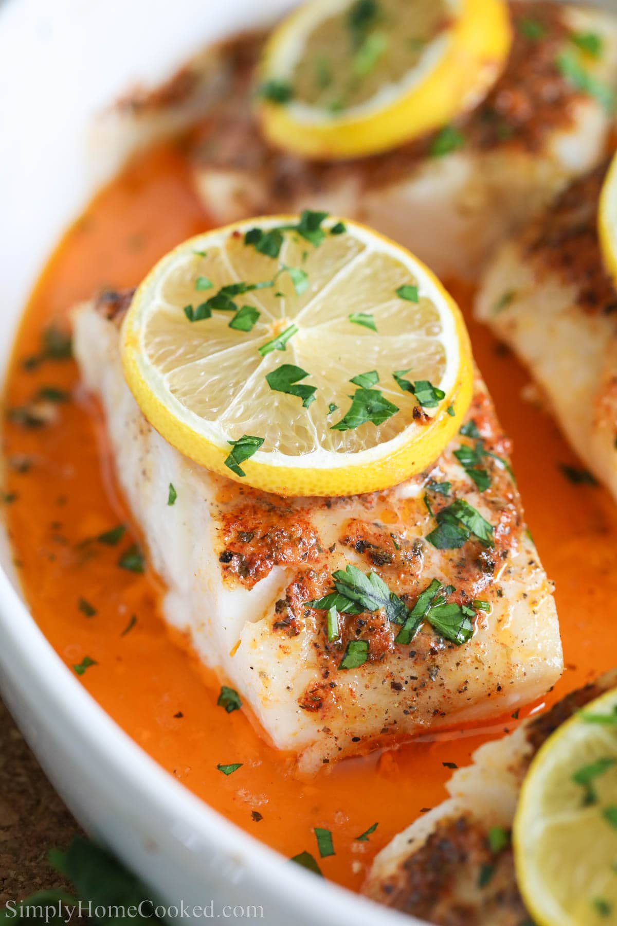 close up image of lemon butter cod with parsley on top