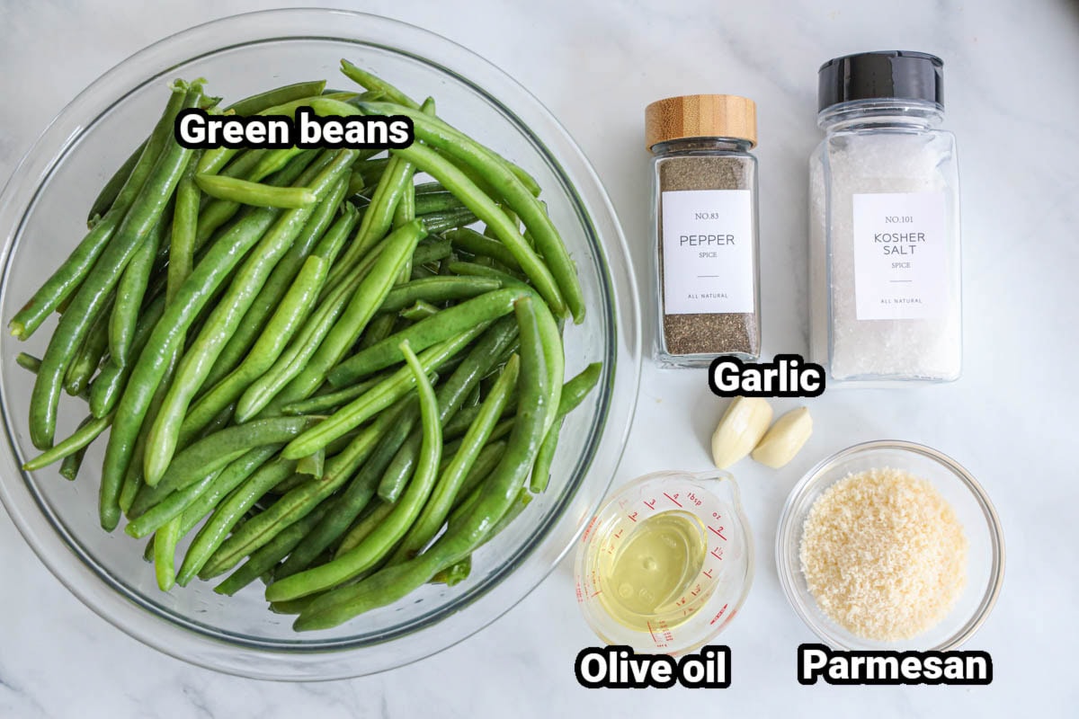 Ingredients for Roasted Green Beans: green beans, black pepper, kosher salt, olive oil, fresh garlic cloves, and parmesan cheese.