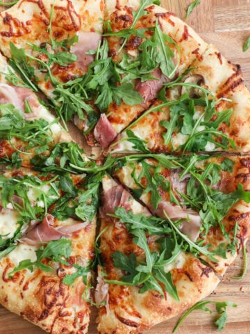 Sourdough Pizza with arugula and prosciutto.