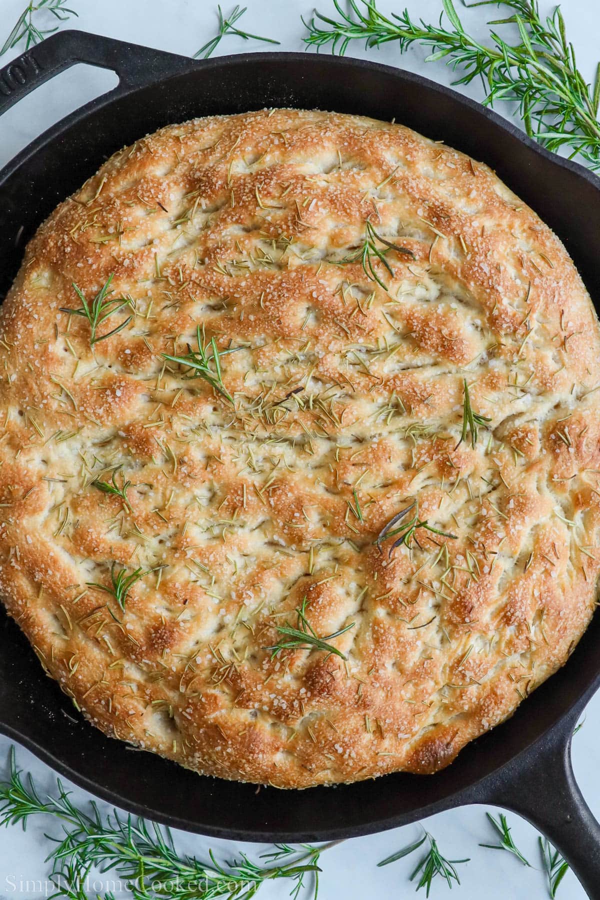 Sourdough Focaccia in a cast iron pan.