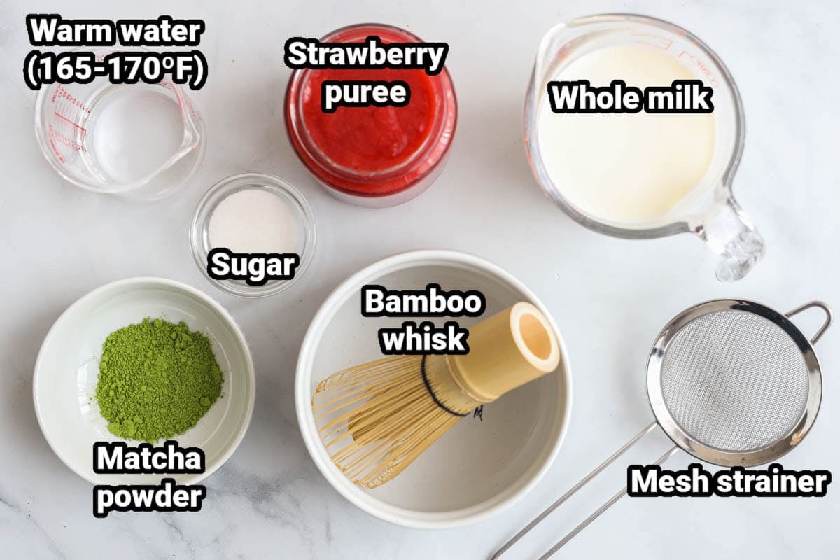 Ingredients for Strawberry Matcha: warm water, strawberry puree, whole milk, sugar, matcha powder, a bamboo whisk, and a mesh strainer.