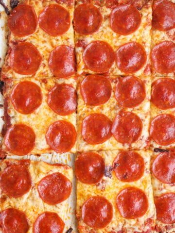 Chicken Crust Pizza cut into slices.